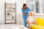long-shot-nurse-helping-old-woman-with-her-coat_23-2148239064(1).jpg